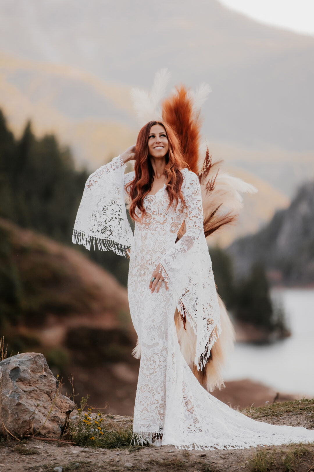 bride smiling in wedding dress at tibble fork reservoir