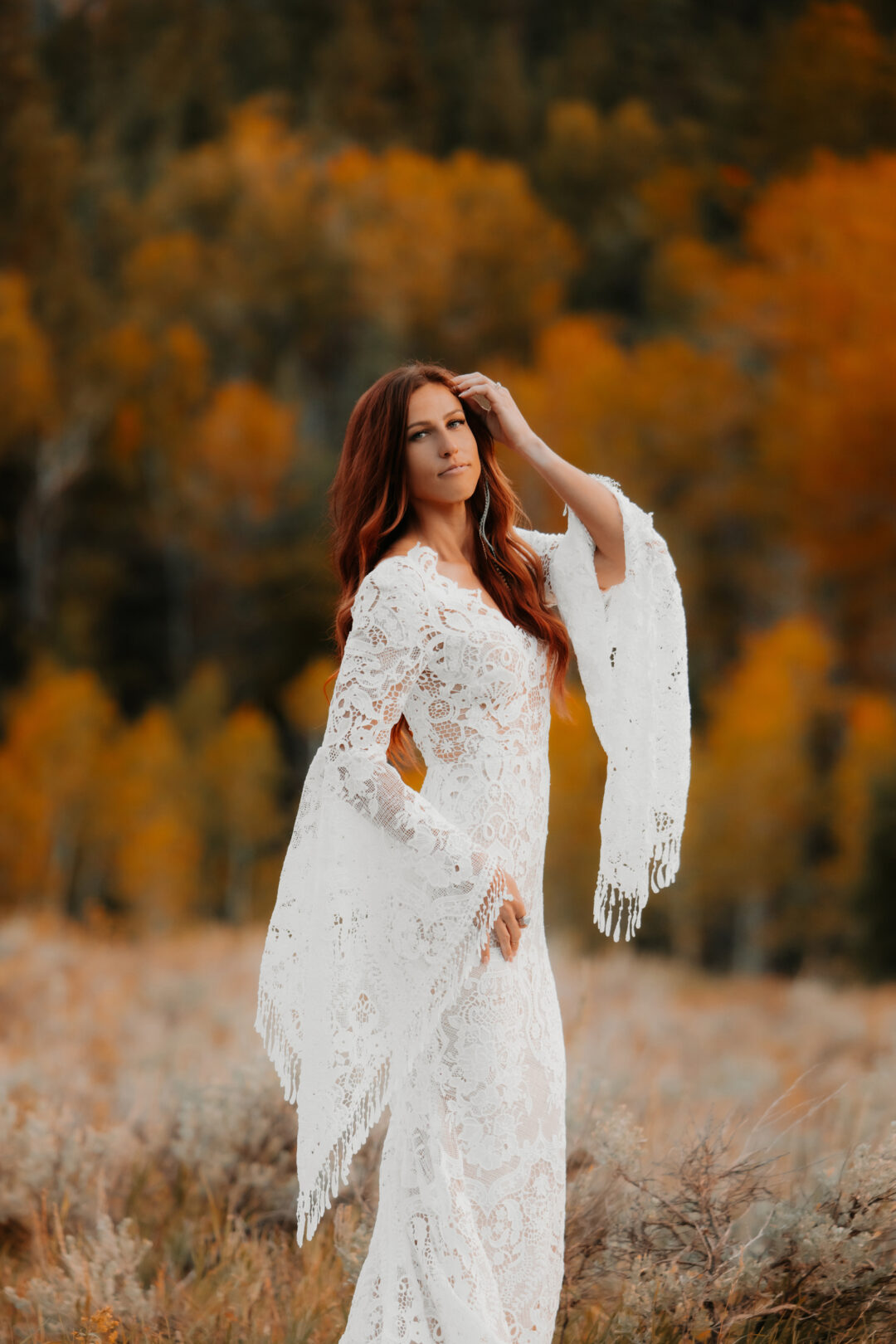Bride in her wedding dress in the fall colors
