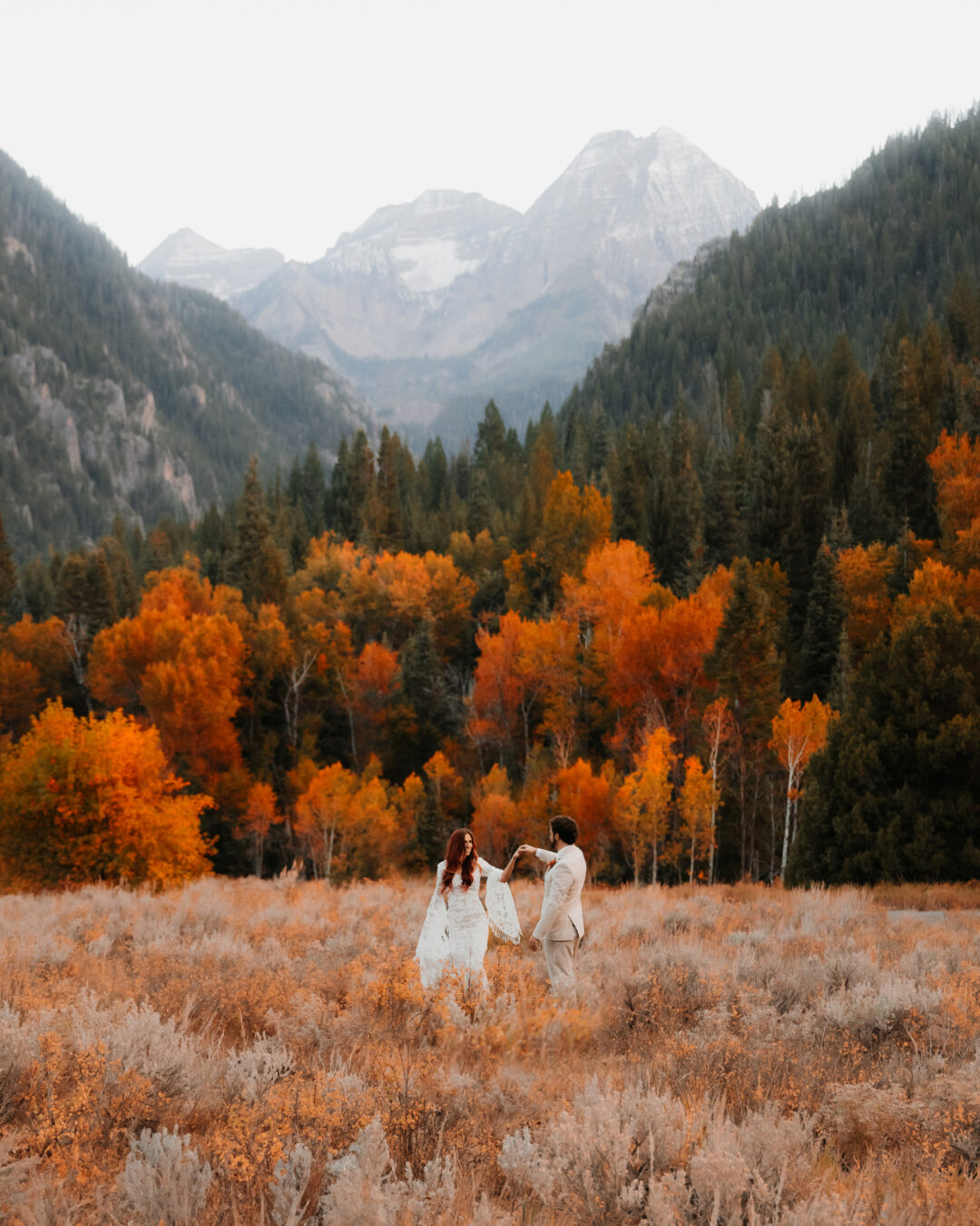 Epic Utah elopement and wedding location, bride and groom dancing in big open field for wedding photography