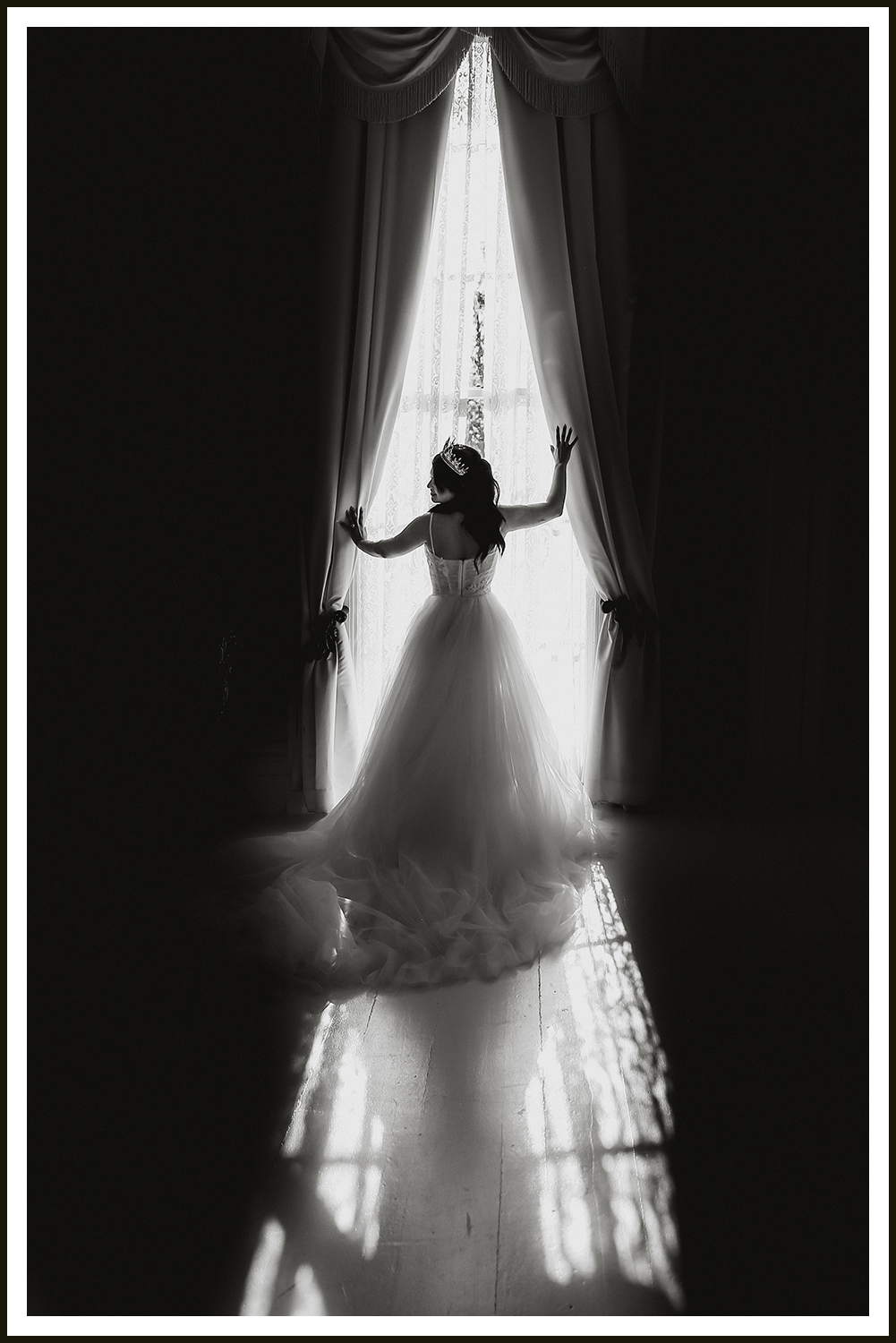 A bride and groom in ornate Indian clothing with a vast desert landscape with stormy skies and lighting with dreamy sunset lighting.