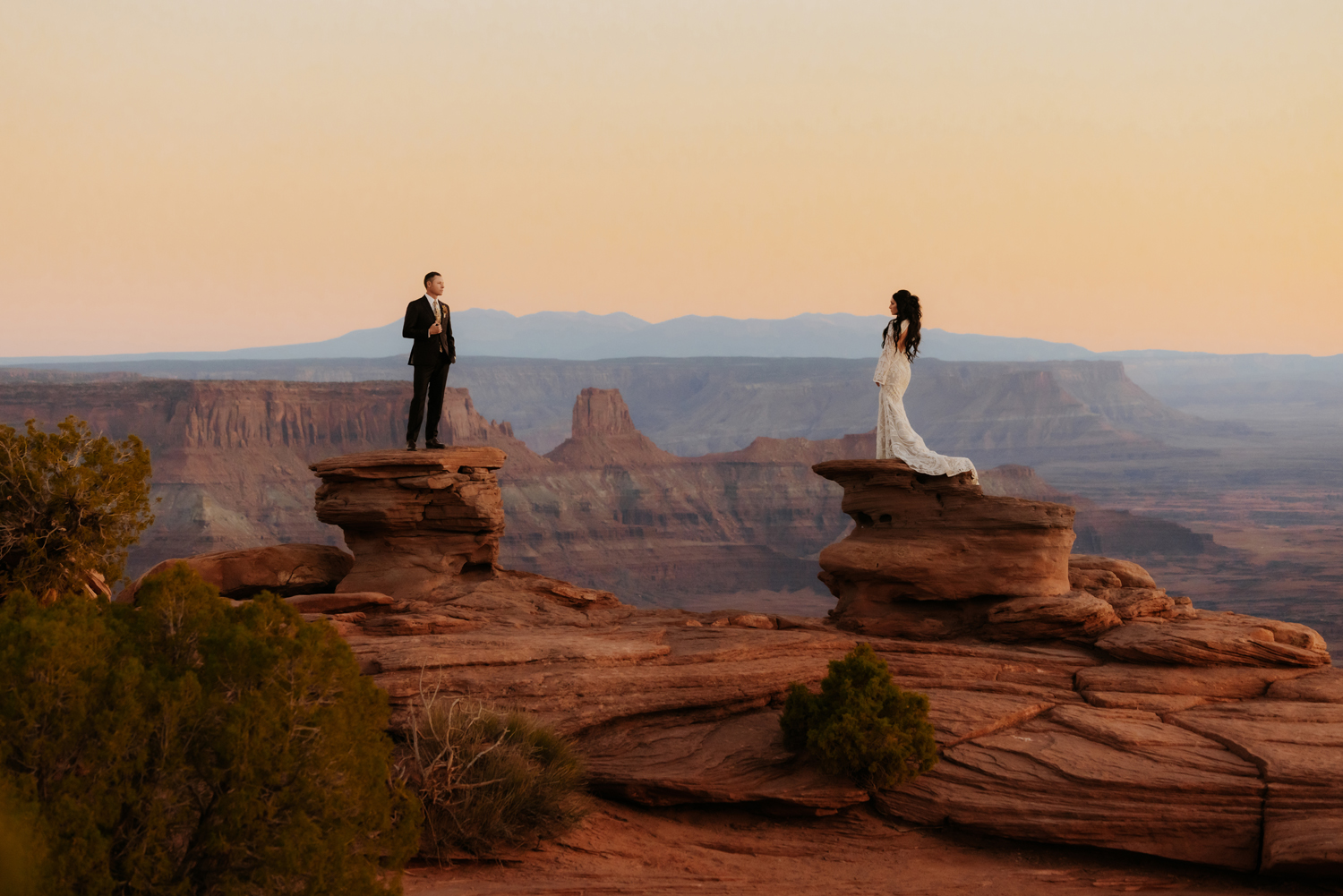 Cinematic Sunset lighting of a bride and groom at their elopement in Moab at Dead Horse State Park.