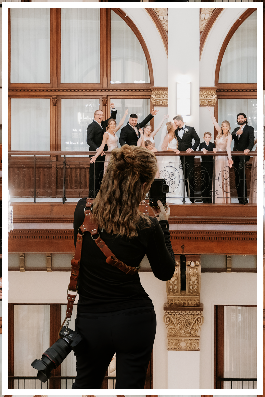 A bride and groom in ornate Indian clothing with a vast desert landscape with stormy skies and lighting with dreamy sunset lighting.