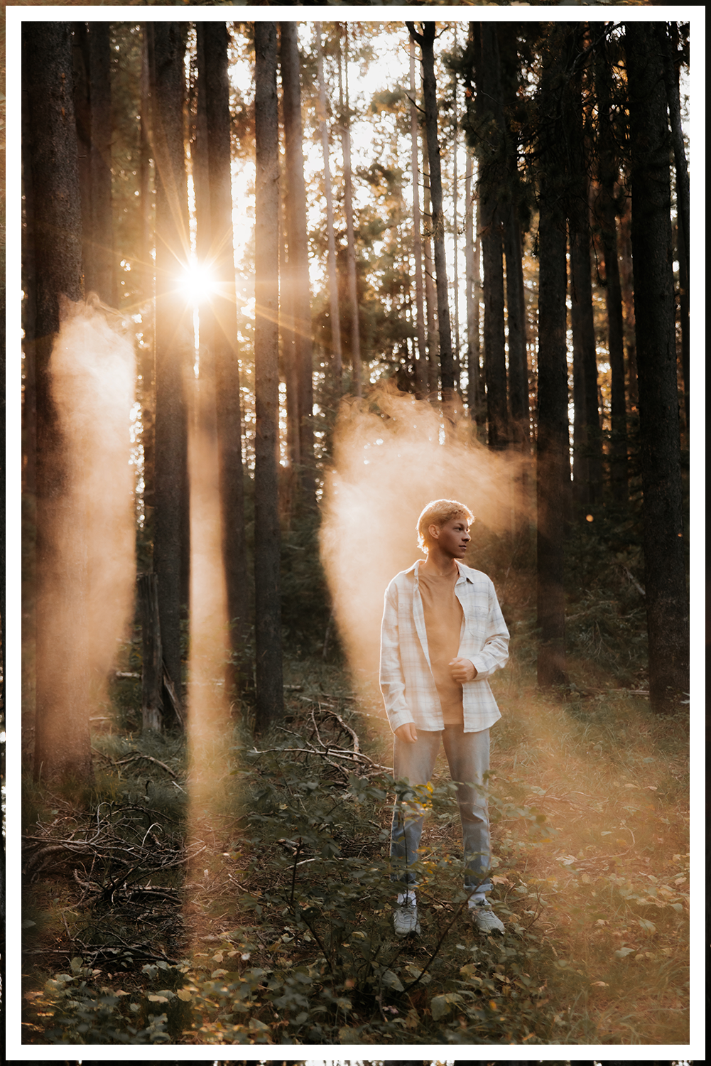 A bride and groom in ornate Indian clothing with a vast desert landscape with stormy skies and lighting with dreamy sunset lighting.